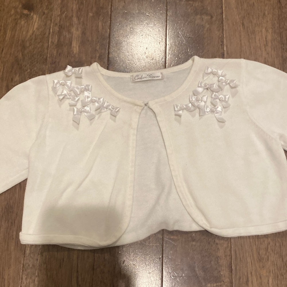 Fancy white sweater with bows